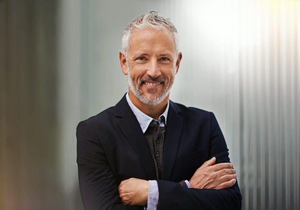 VP of Sales in 180 Days A confident VP of Sales with his arms folded