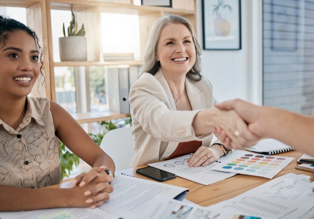 meeting-handshake-and-collaboration-with-a-busine-2025-04-06-07-39-48-utc A homebuilder shaking hands with a candidate after looking for hiring red flags.