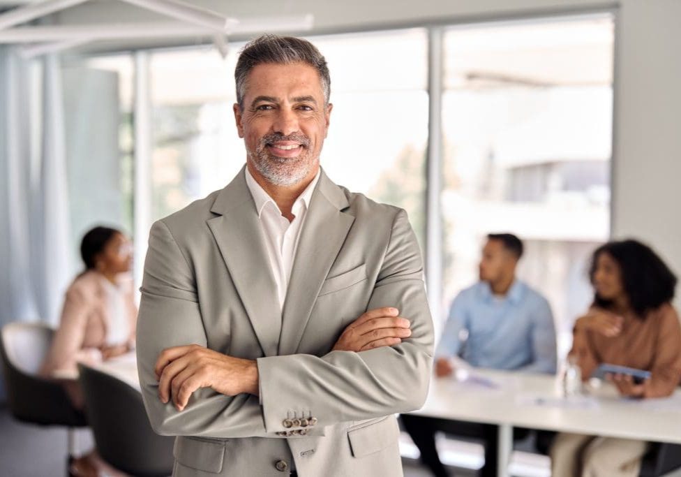 How to Assess Sales Leadership Candidates Before Hiring in Manufacturing Confident senior sales executive representing the caliber of sales leadership talent Precision Sales Recruiting screens and places for manufacturing and industrial B2B companies